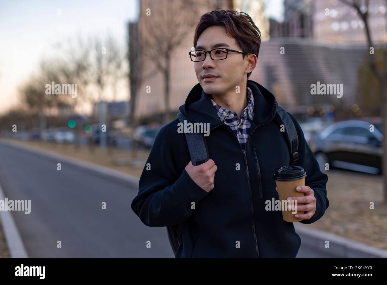 Chinese IT worker holding a cup of coffee Stock Photo