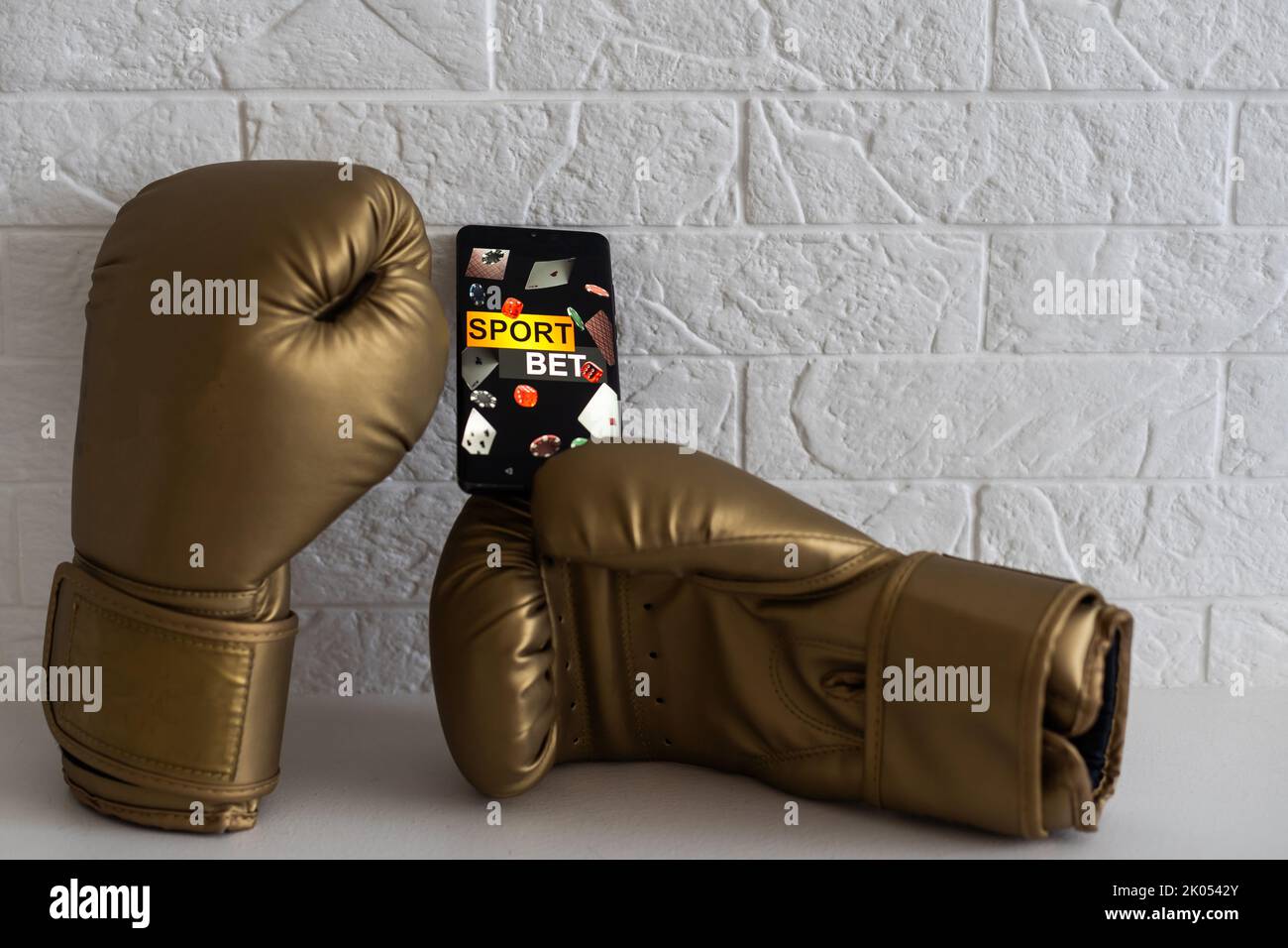 betting through smartphone at the boxing match on a white background Stock Photo