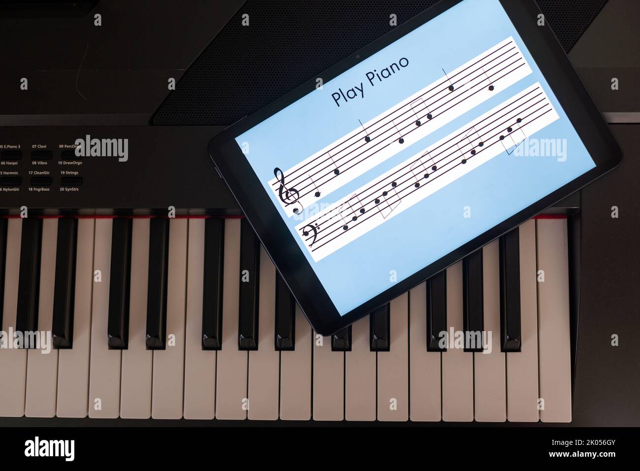 Piano synthesizer app on tablet and musical instrument concept Stock