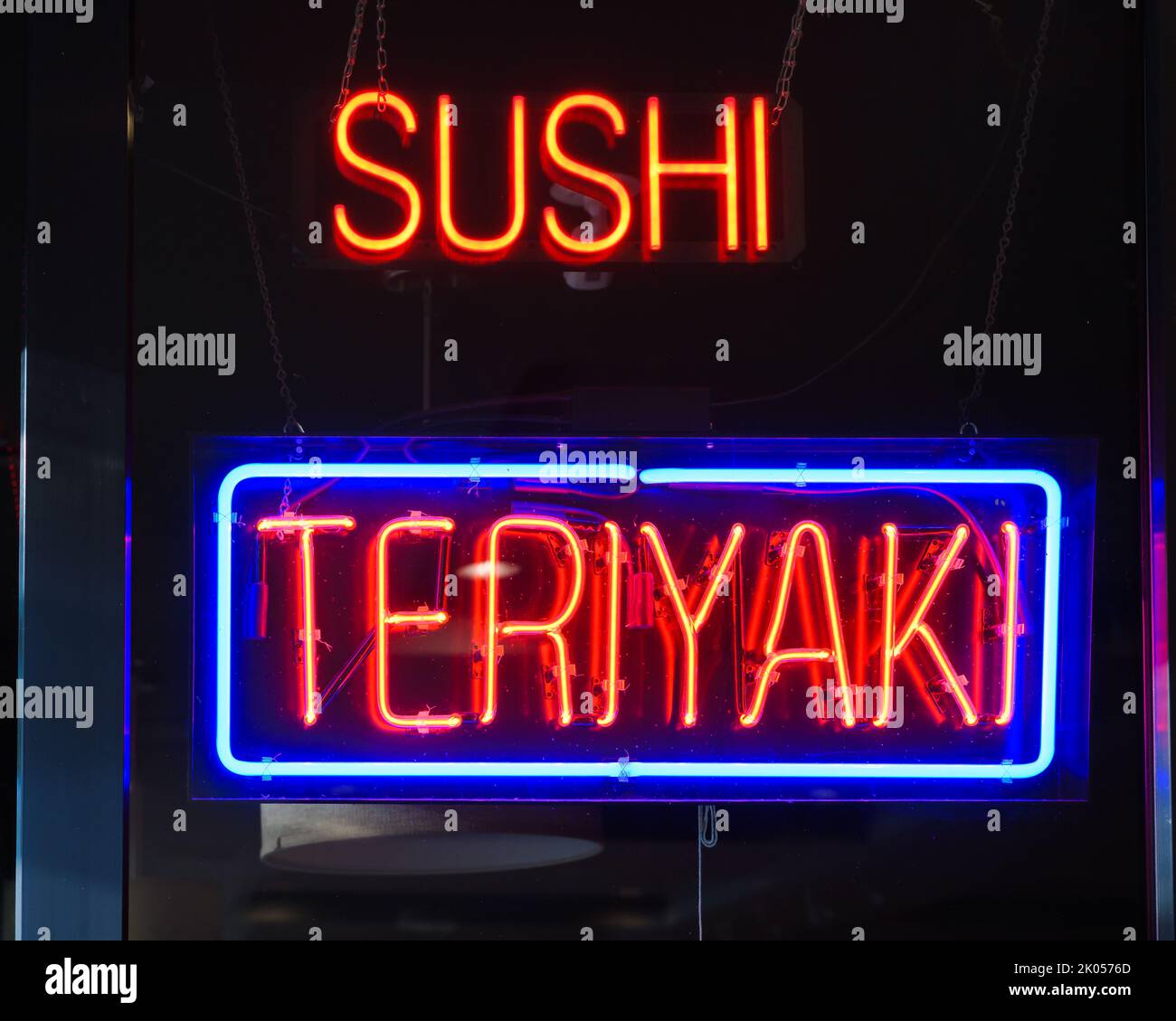 Neon window sign for Sushi and Teriyaki in close up Stock Photo