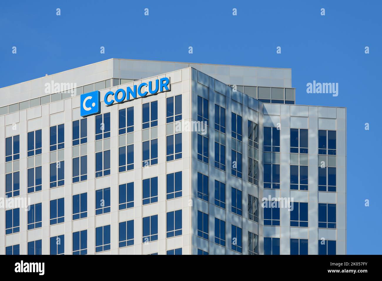 Bellevue, WA, USA - September 08, 2022; SAP business Concur name on office tower in Bellevue with windows and blue sky Stock Photo