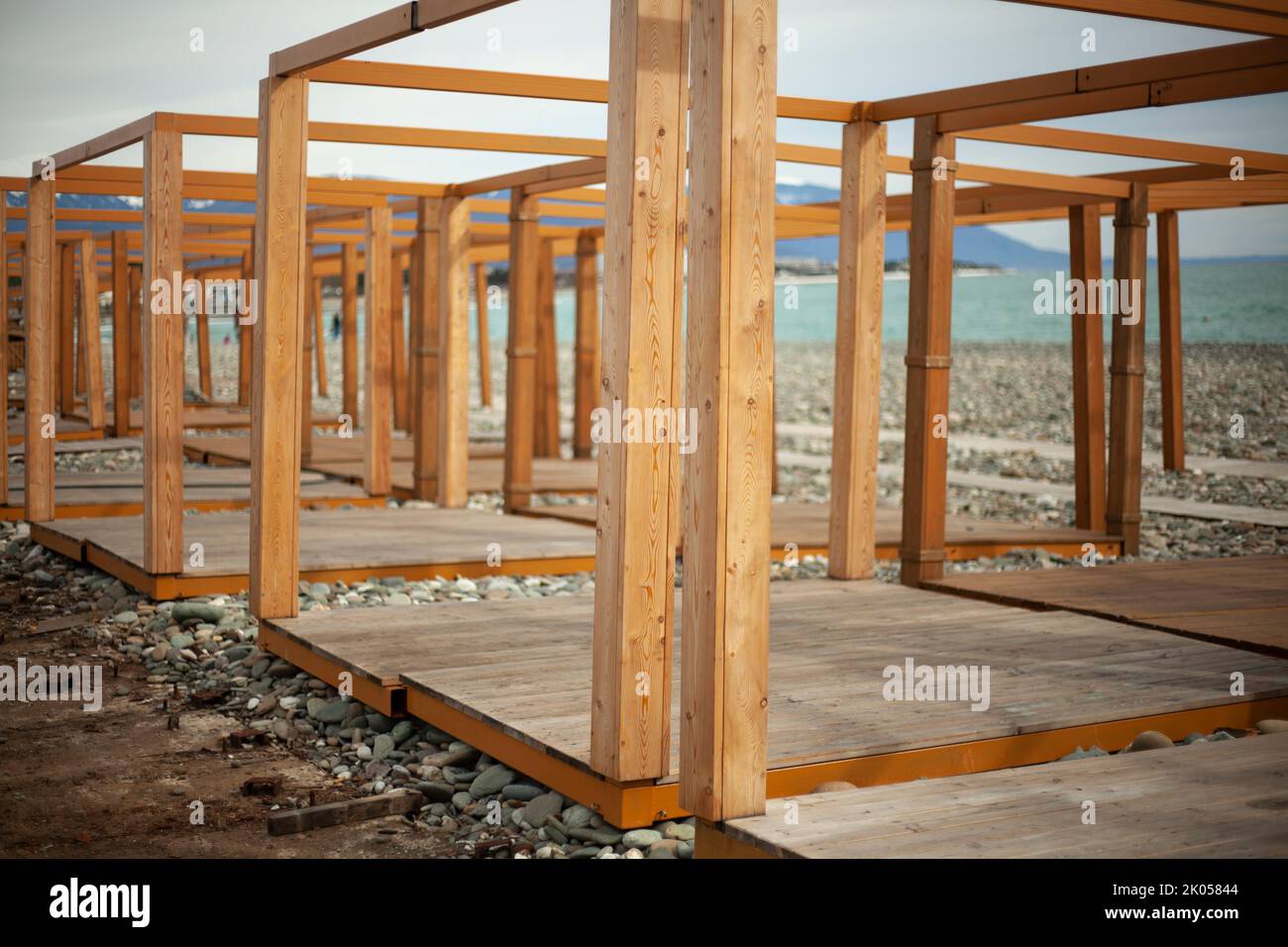 Construction of fair on embankment. Wooden construction of boards. Repair of market in city on seashore. Stock Photo