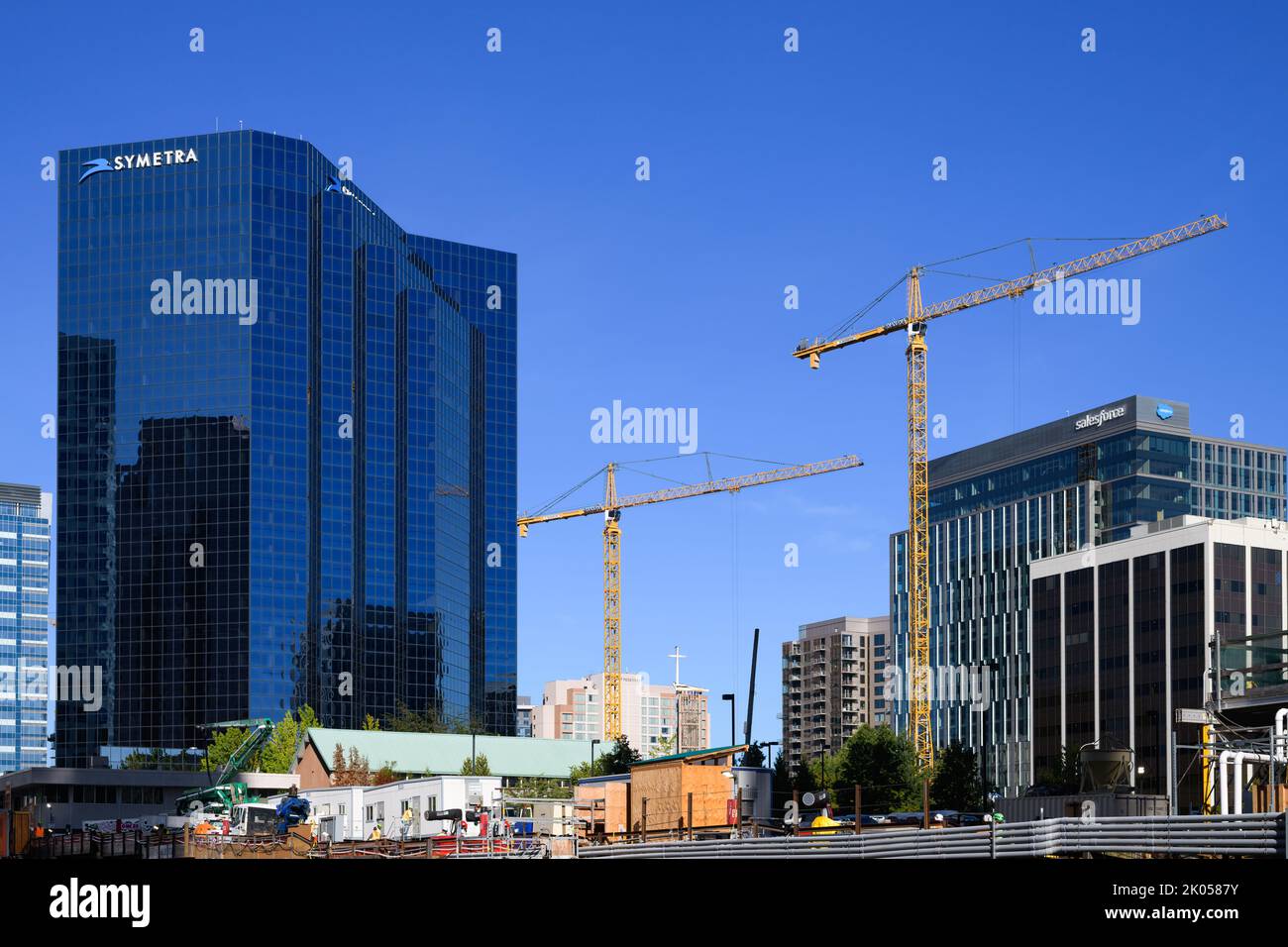 Bellevue, WA, USA - September 08, 2022; Cranes at new developpment construction in downtown Bellevue with Symetra and Salesforce high rises Stock Photo