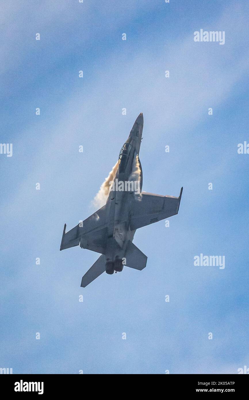 A U.S. Navy F/A-18F Super Hornet with Strike Fighter Squadron (VFA) 106 stationed at Naval Air Station Oceana, Virginia, performs at the 2022 Atlantic City Airshow at Atlantic City, New Jersey, Aug. 24, 2022. (U.S. Army National Guard photo by Spc. Michael Schwenk) Stock Photo