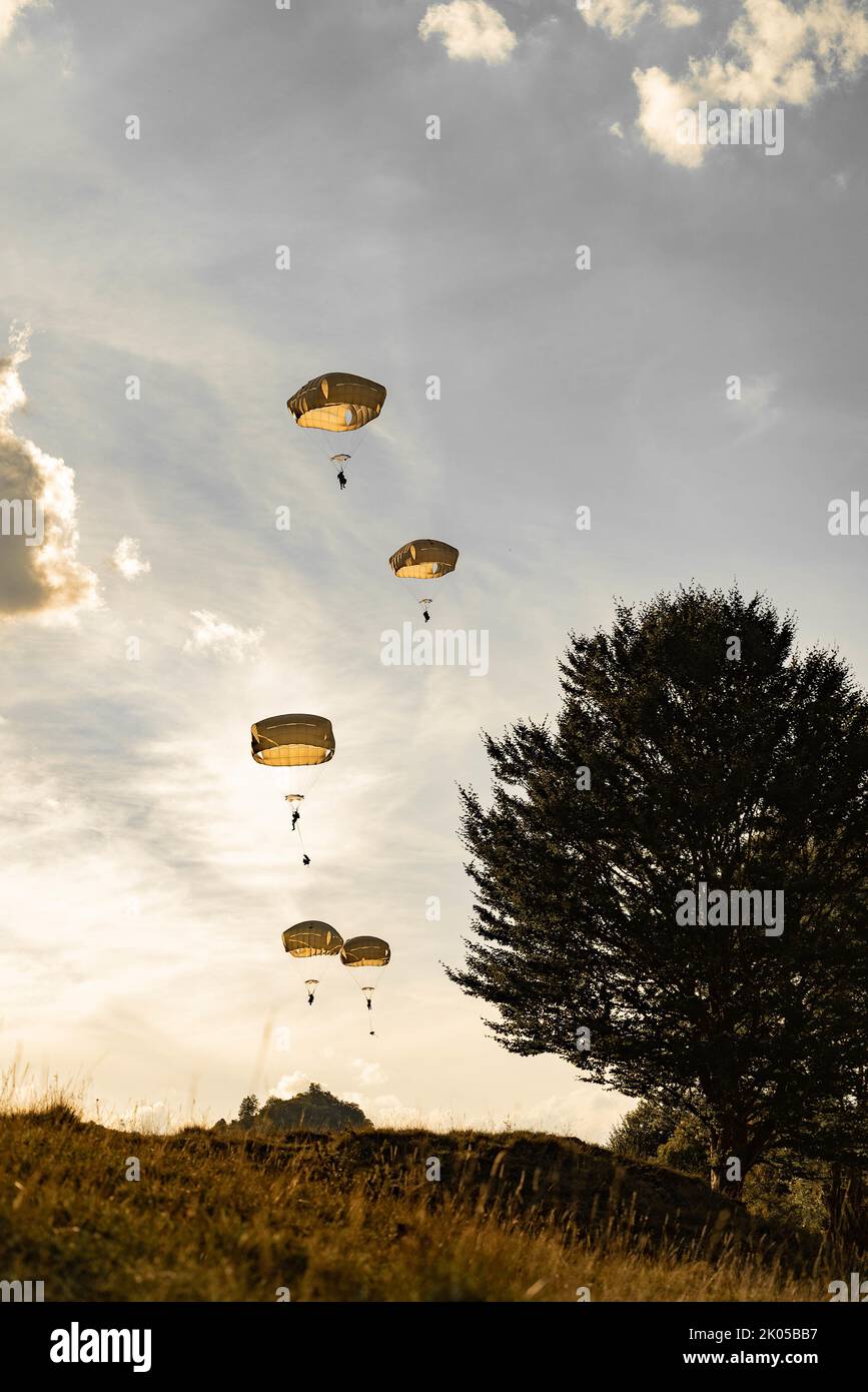 U.S. Army paratroopers, assigned to the 173rd Infantry Brigade Combat Team- Airborne (173rd IBCT ABN), conduct a Joint Forceable Entry mission into the Hohenfels Training Area during Exercise Saber Junction 22 at the Joint Multinational Readiness Center in Hohenfels, Germany, Sept. 7, 2022.       Saber Junction 22 is a multinational rotational exercise designed to assess the readiness of the U.S. Army’s 173rd Airborne Brigade to execute unified land operations in a joint, combined environment and to promote interoperability with more than 4,500 participants from the U.S. and Allied and partner Stock Photo