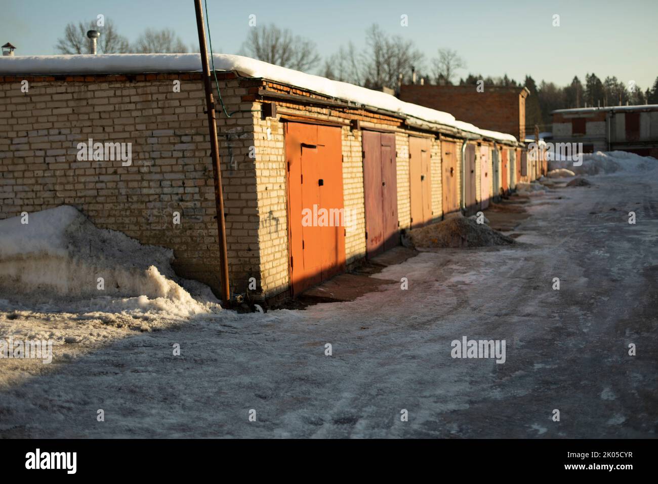 Garages in Russia. One-storey brick building. Travel in winter. Stock Photo