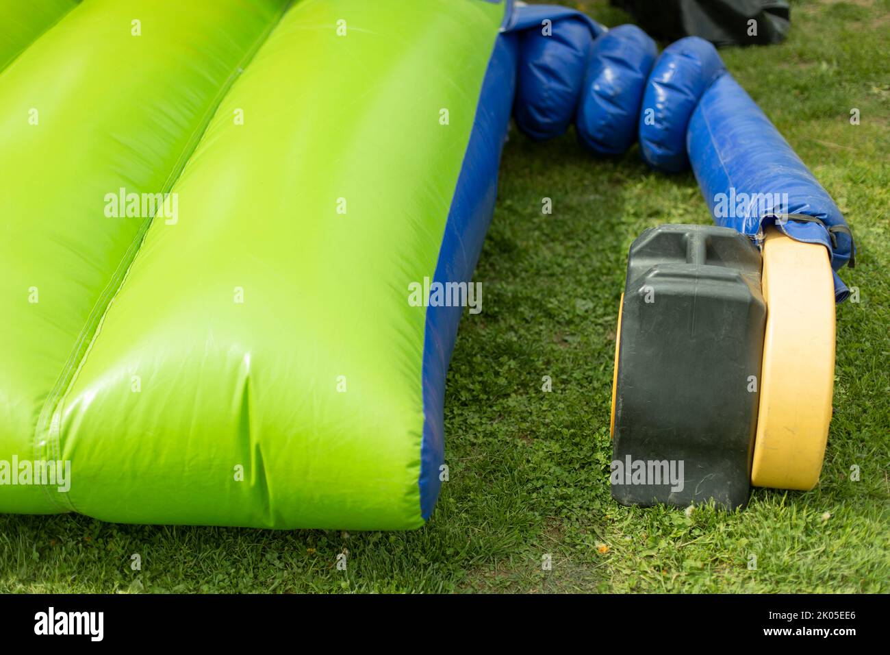 Inflate obstacle course using air generator. Obstacle course in park. Stock Photo