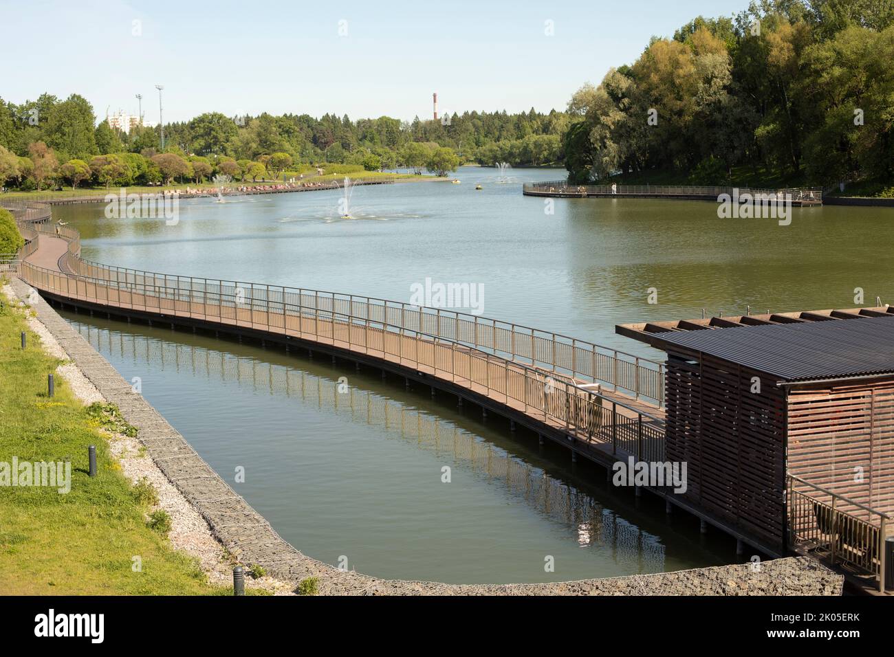 Embankment on lake. View of park. City Pond. Details of design of embankment. Stock Photo