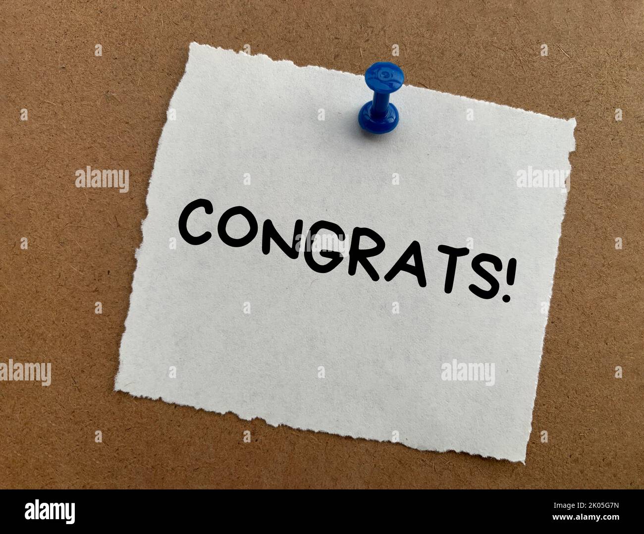 Congrats text on white notepad with wooden background. Appreciation concept. Stock Photo