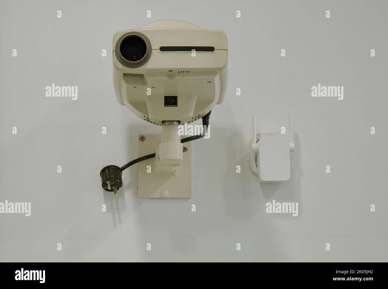 Projector hanging on the wall Stock Photo