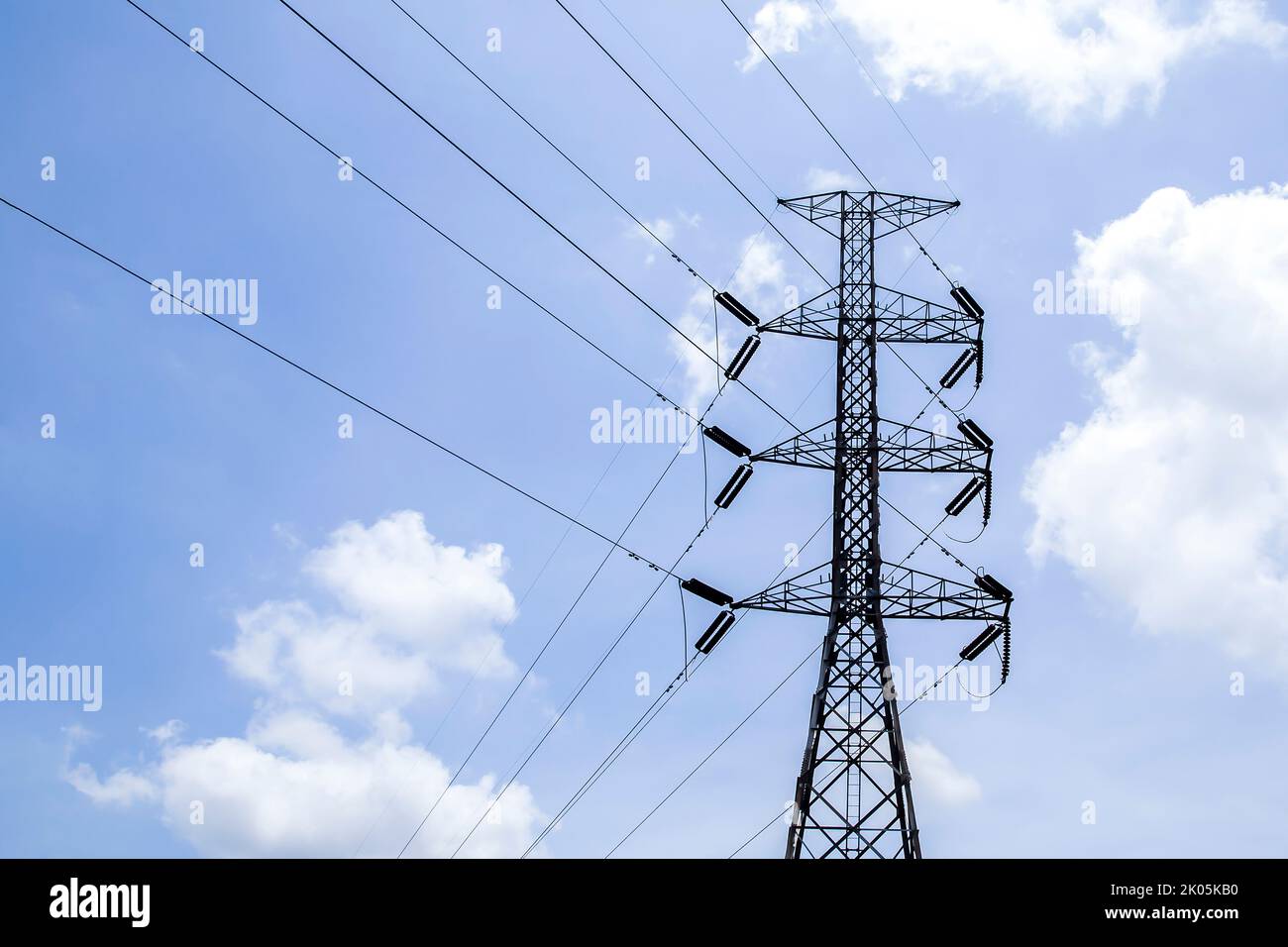 High voltage poles with sky and clouds in the background Stock Photo ...