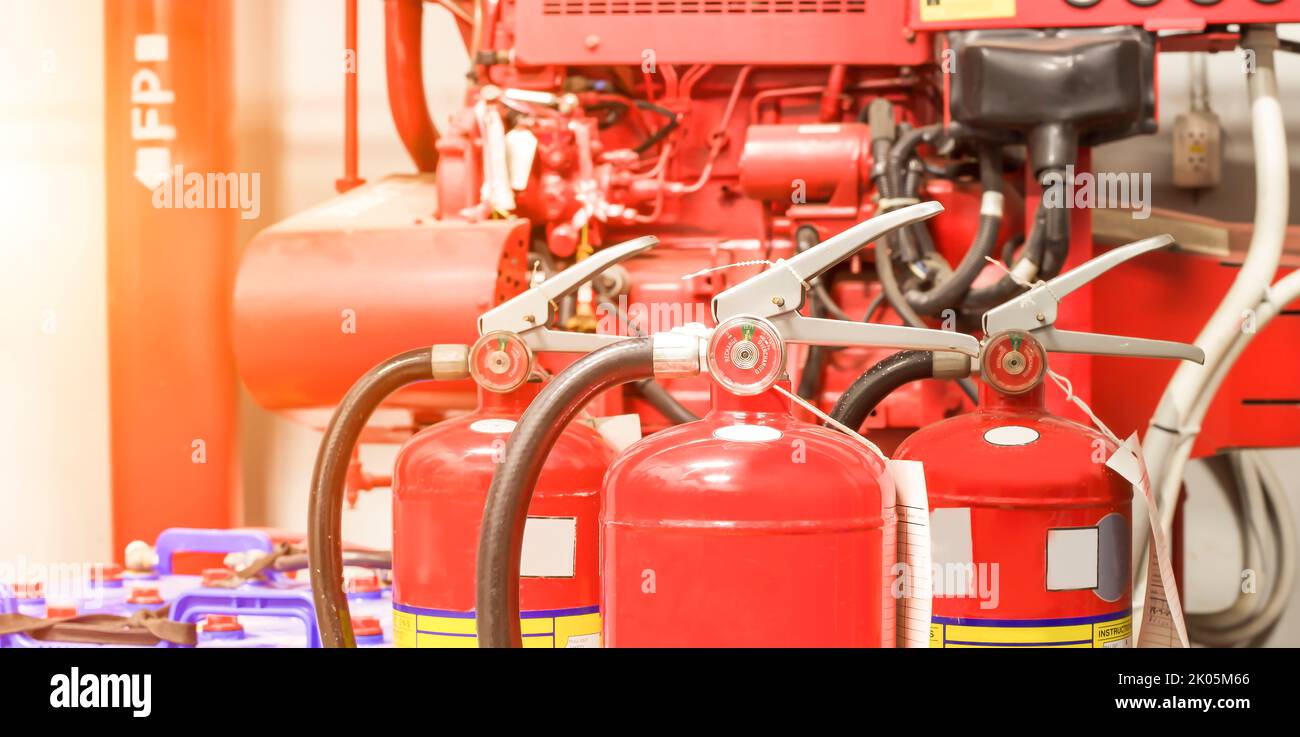 The red fire extinguisher is ready for use in case of an indoor fire