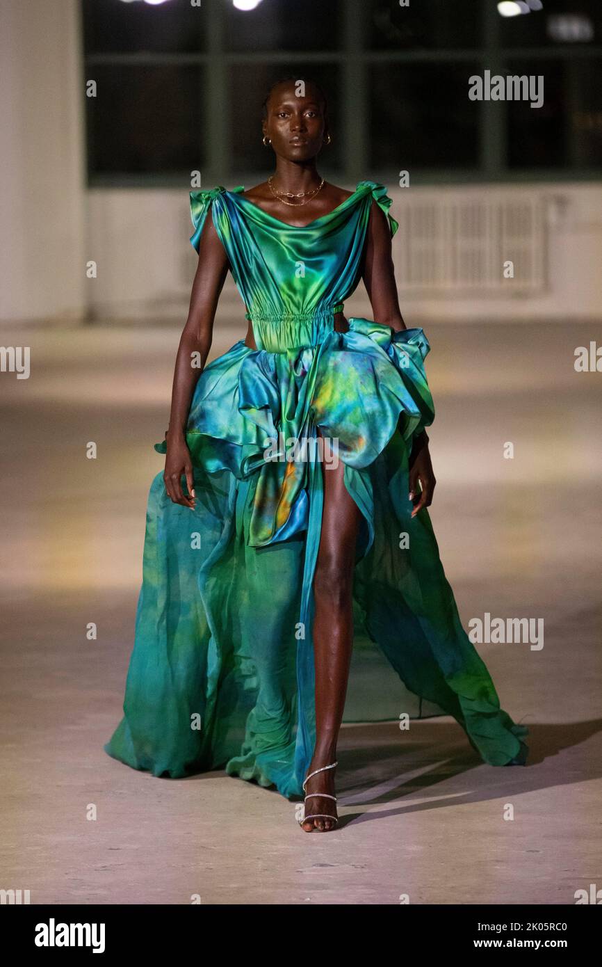 A model walks on the runway at the Fe Noel fashion show during the