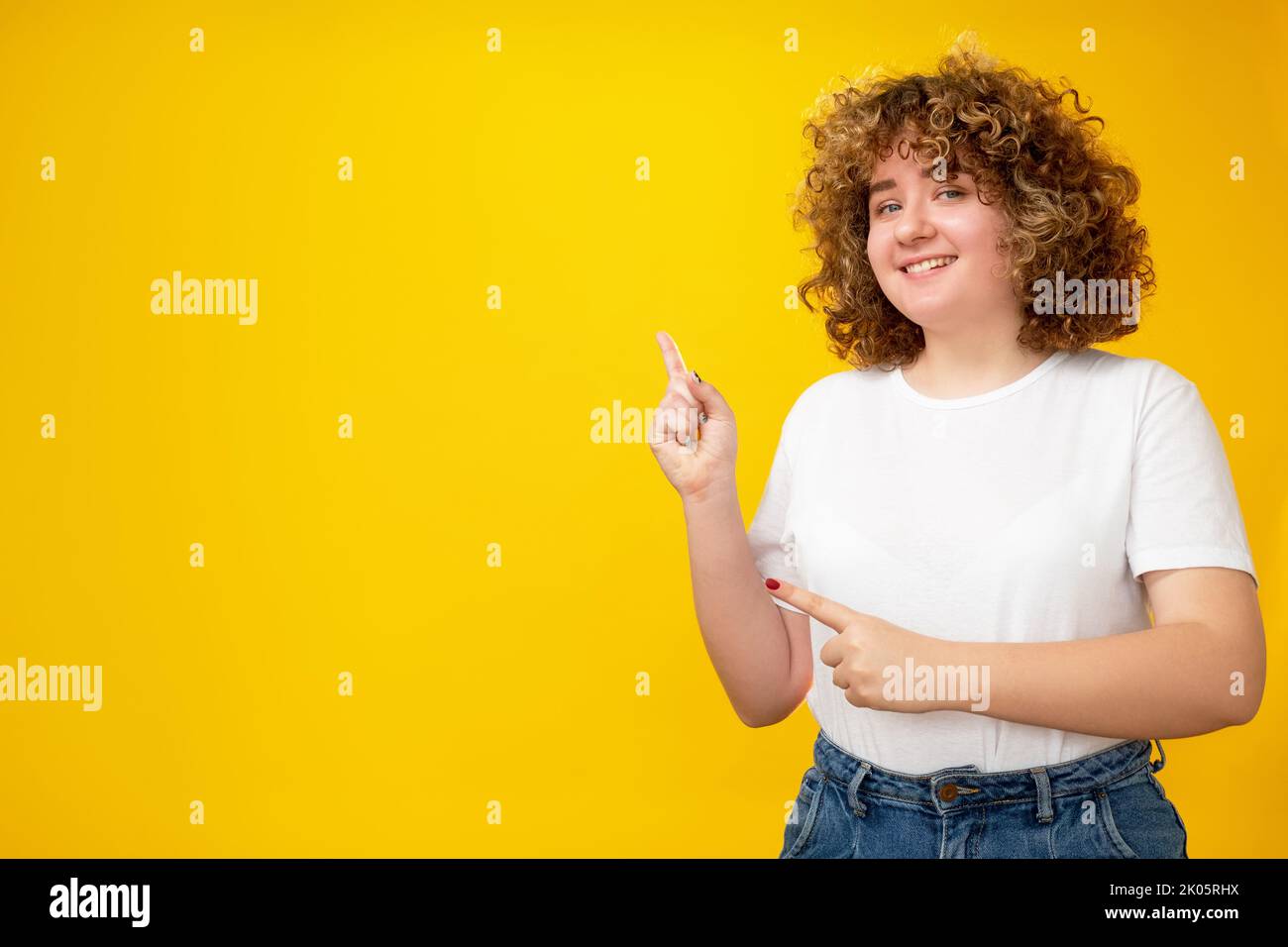 pointing girl presenting product overweight woman Stock Photo