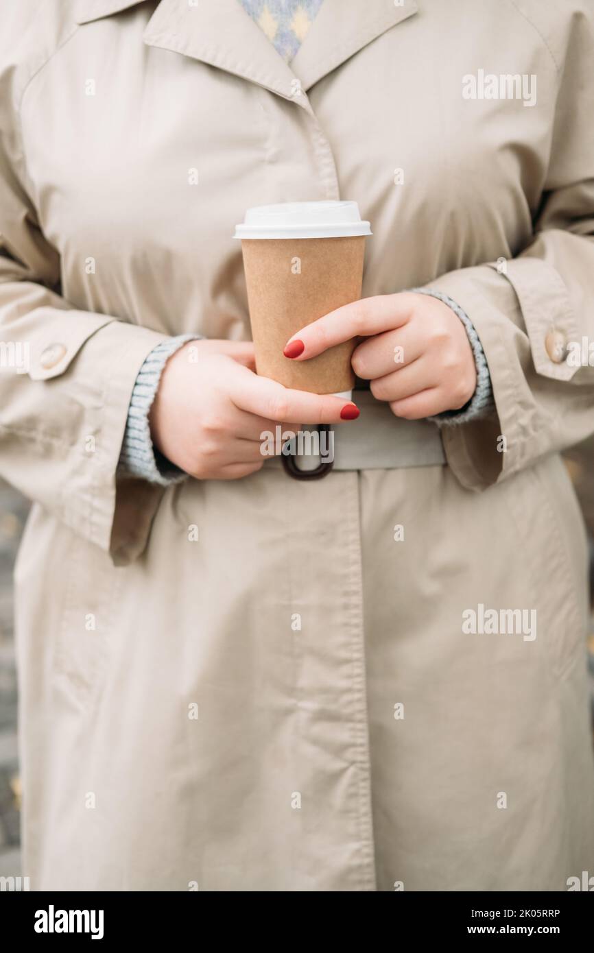 coffee break hot drink woman coat hands paper cup Stock Photo - Alamy