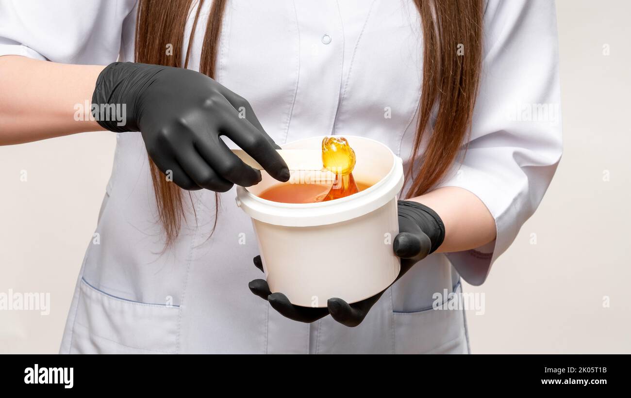 honey waxing natural hair removal beautician glove Stock Photo Alamy