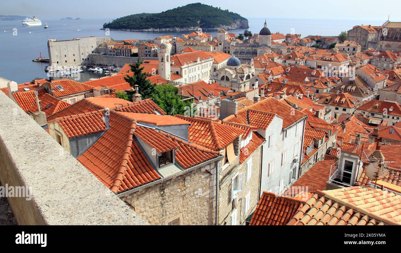 View over tiled roofs of the old town, Adriatic Sea in the background, Dubrovnik, Croatia Stock Photo