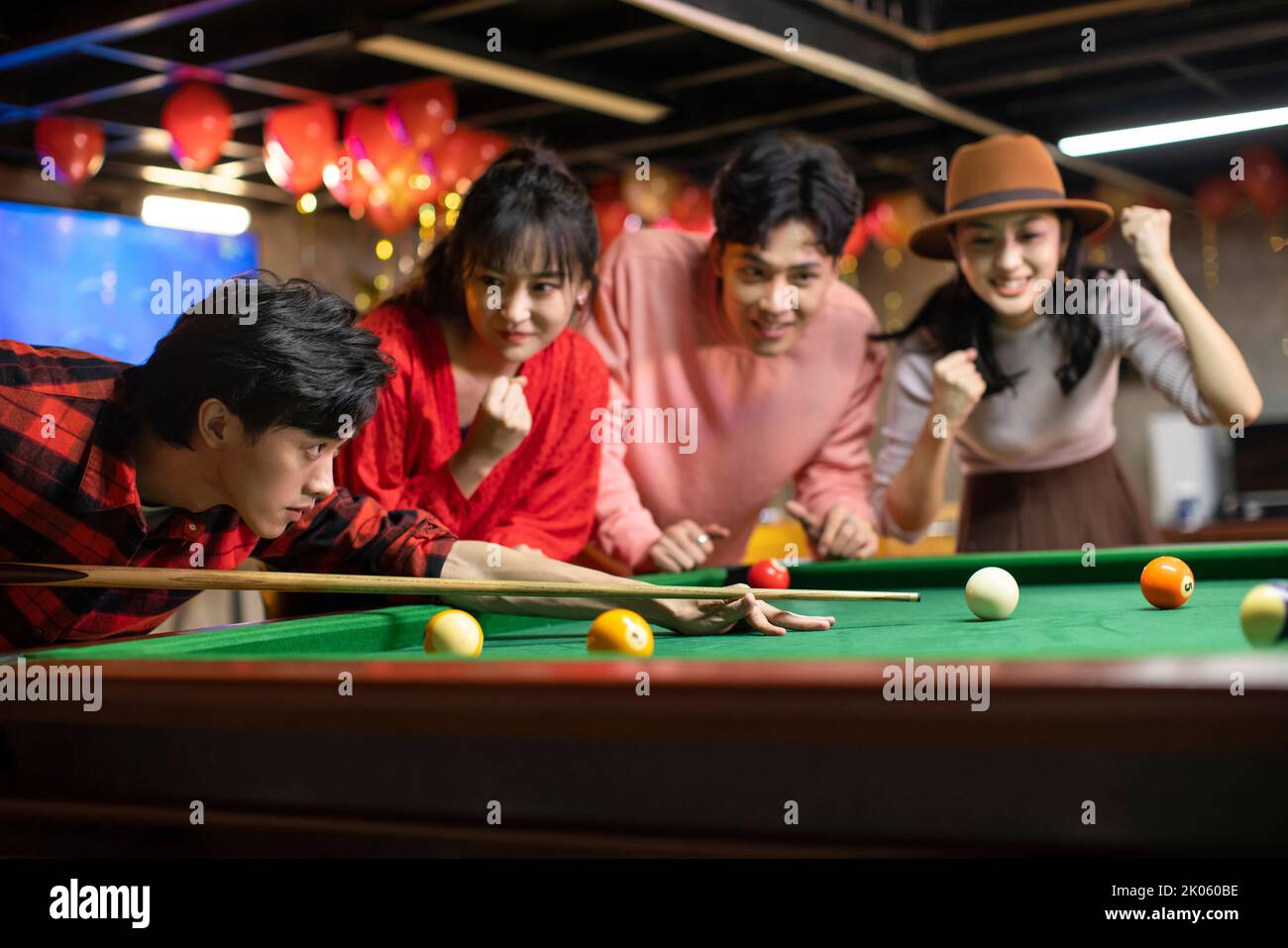 Happy young Chinese friends playing billiard together Stock Photo - Alamy