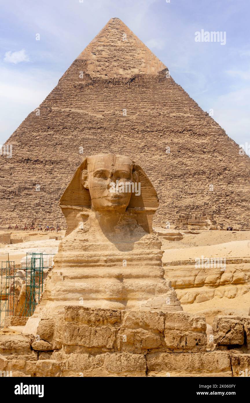 Sphinx of Giza with the Pyramid of Khafre in the background Stock Photo ...