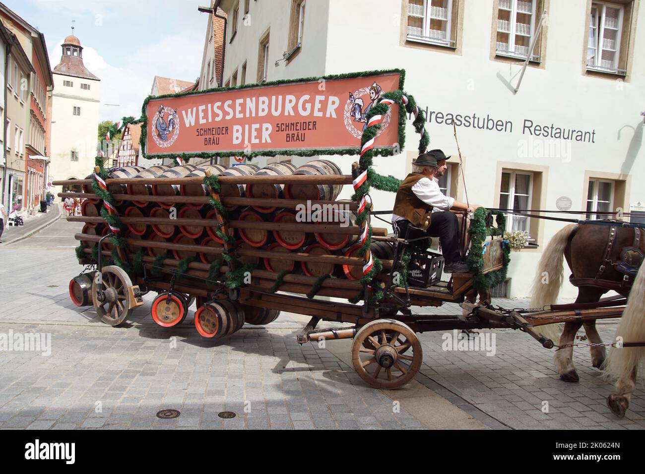 Parade after the festival, called Kirchweih in the German city of Weissenburgh in the Ellinger Strasse. Horses, wagon with beer barrels. Summer August Stock Photo