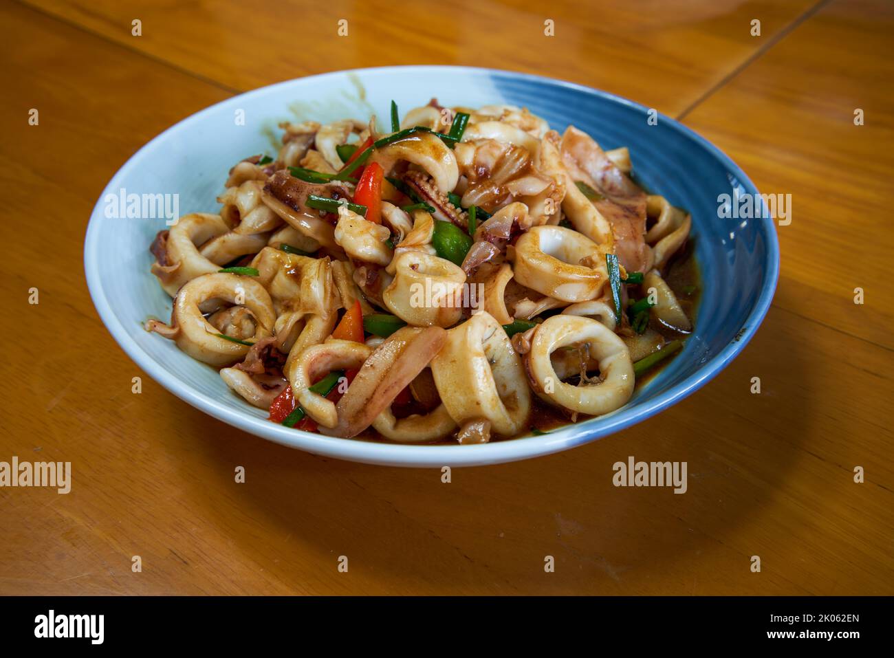 A plate of delicious and fragrant Chinese food with fried squid rings Stock Photo