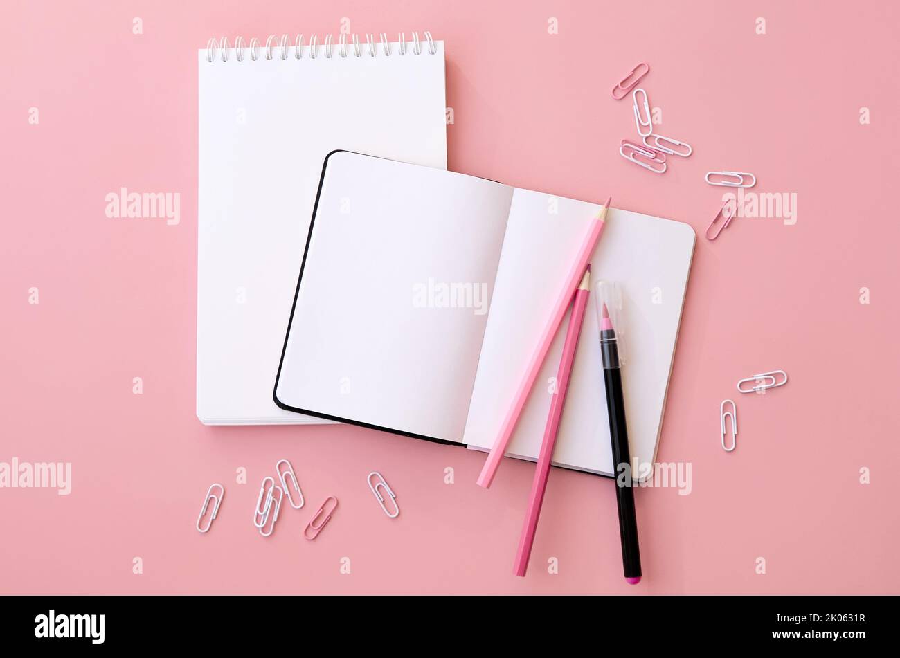 Back to school supplies open notebook on pink background, flatlay, copy ...