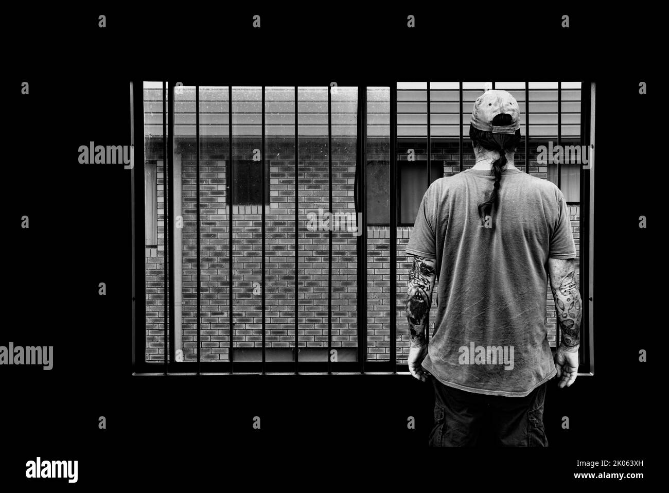 MAN BEHIND BARS, BOOK COVER ART Stock Photo Alamy