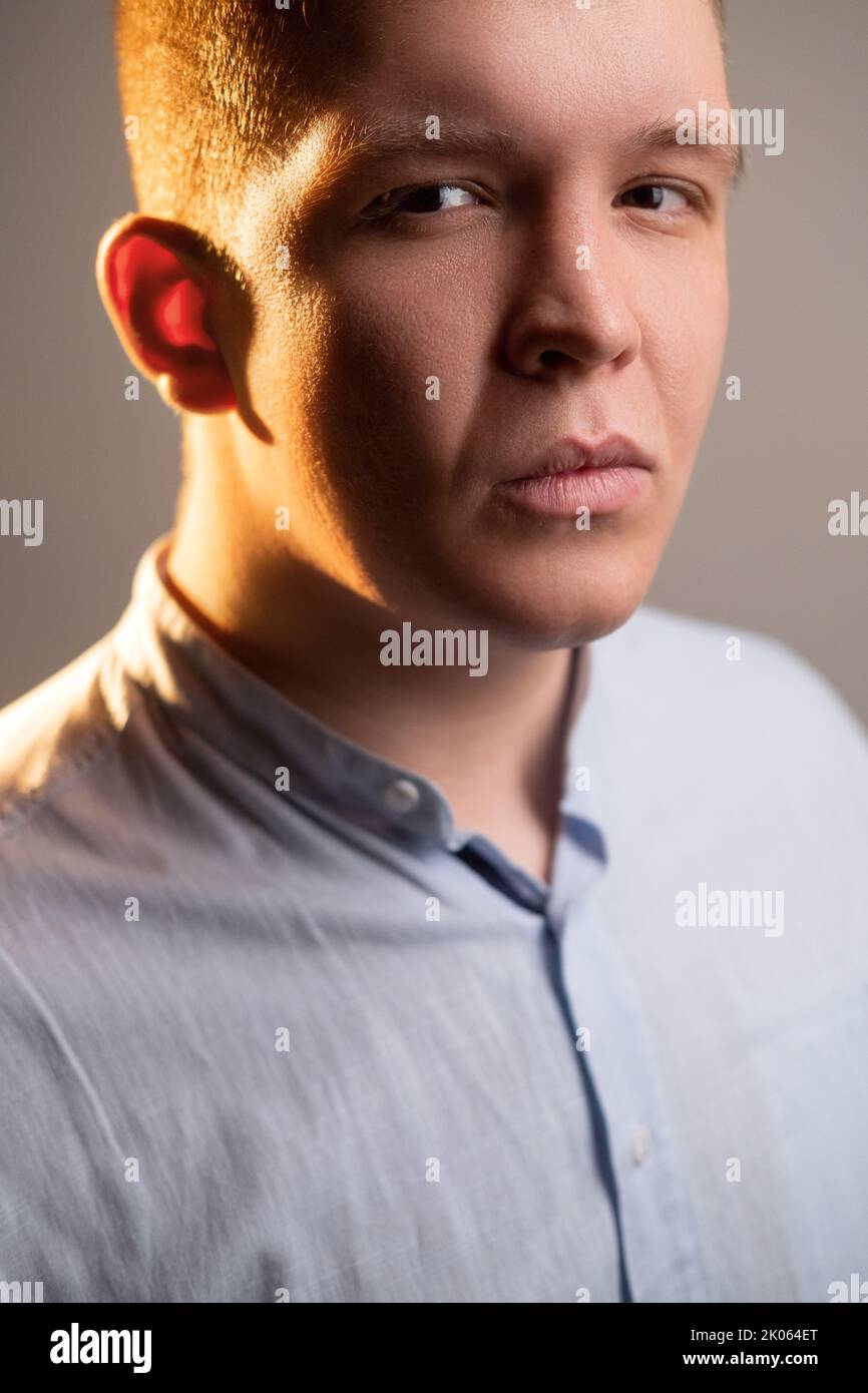 skeptic man portrait body shaming chubby face Stock Photo