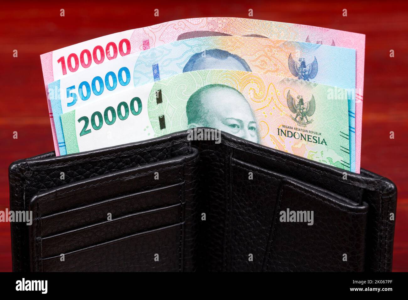 Indonesian money in the black wallet a new serie of banknotes Stock Photo
