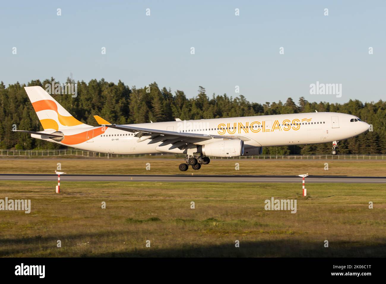 A Sunclass Airbus A330 Widebody jet landing in Oslo coming from a sunny holiday destination Stock Photo