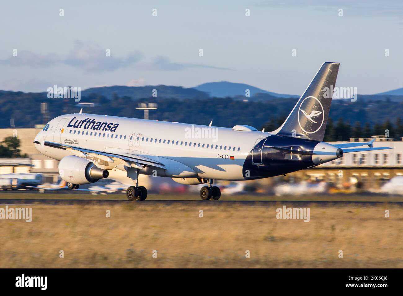 A Lufthansa Airbus A320 on the runway at airport Graz departing for a flight to Munich Stock Photo