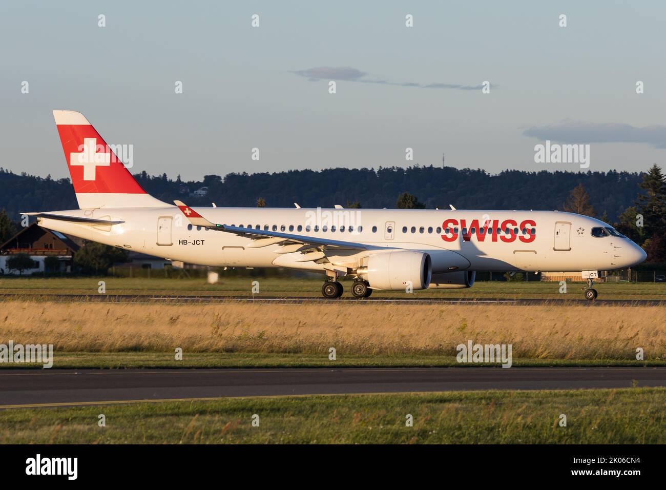 A Swiss Airbus A220 on the runway at airport Graz departing for a flight to Zurich Stock Photo