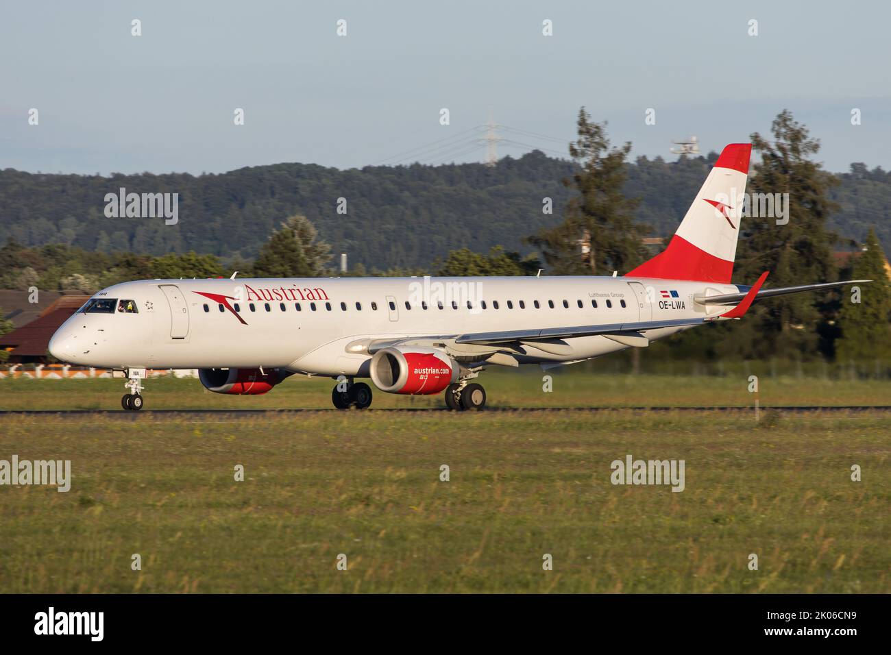 Embraer 195 passenger jet of Austrian Airlines on the runway at Graz Airport Stock Photo
