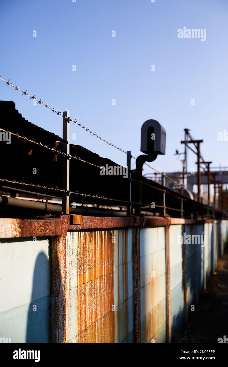 Passage lined with barbed wire; Chidoricho, Kawasaki, Kanagawa Prefecture, Japan Stock Photo