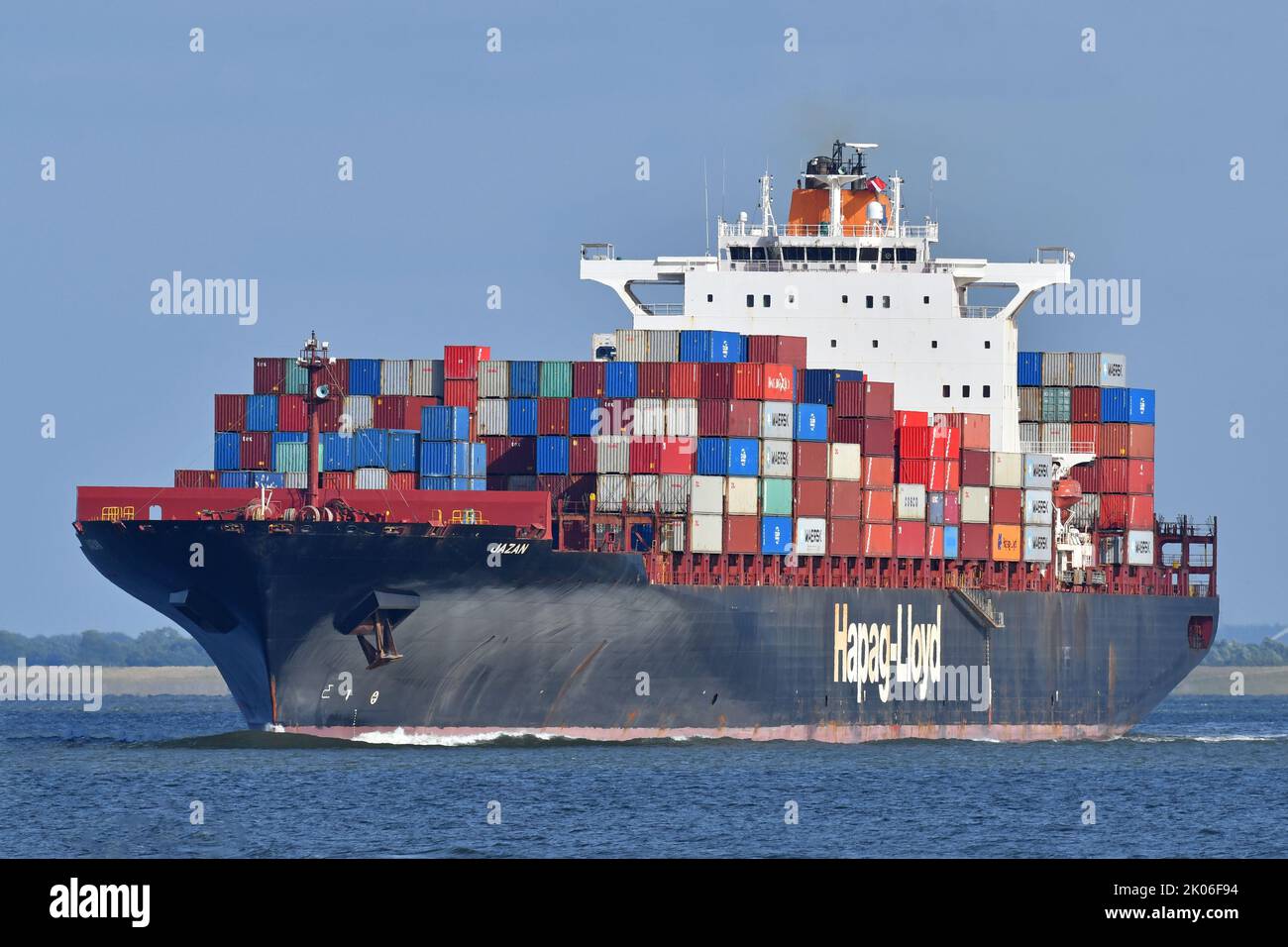 Containership JAZAN outbound from Hamburg, passing Cuxhaven Stock Photo