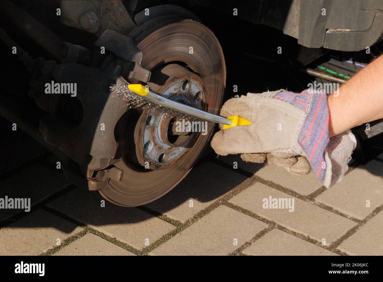 Car repair concept. Repair of a wheel on a passenger car. Remove the