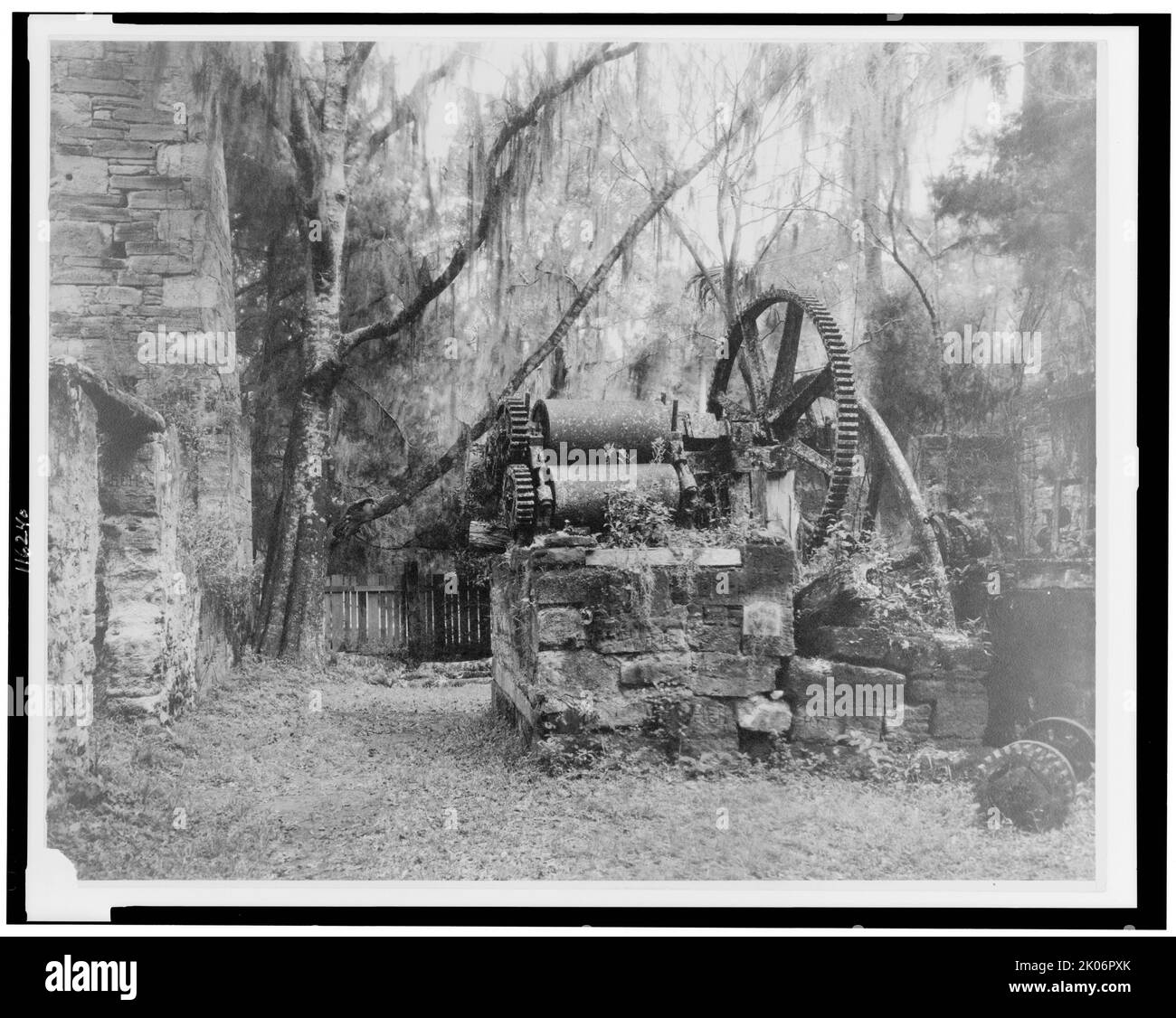 Ruins of an early sugar mill, Orange City, Volusia Co., Florida, between 1936 and 1939. (Such machines were used on slave plantations to process sugar. The slaves would feed lengths of cane between the rotating drums to squeeze out the juice. This was exhausting and dangerous work, and white overseers wouldn't necessarily stop the machine if a hand or arm was crushed between the rollers). Stock Photo