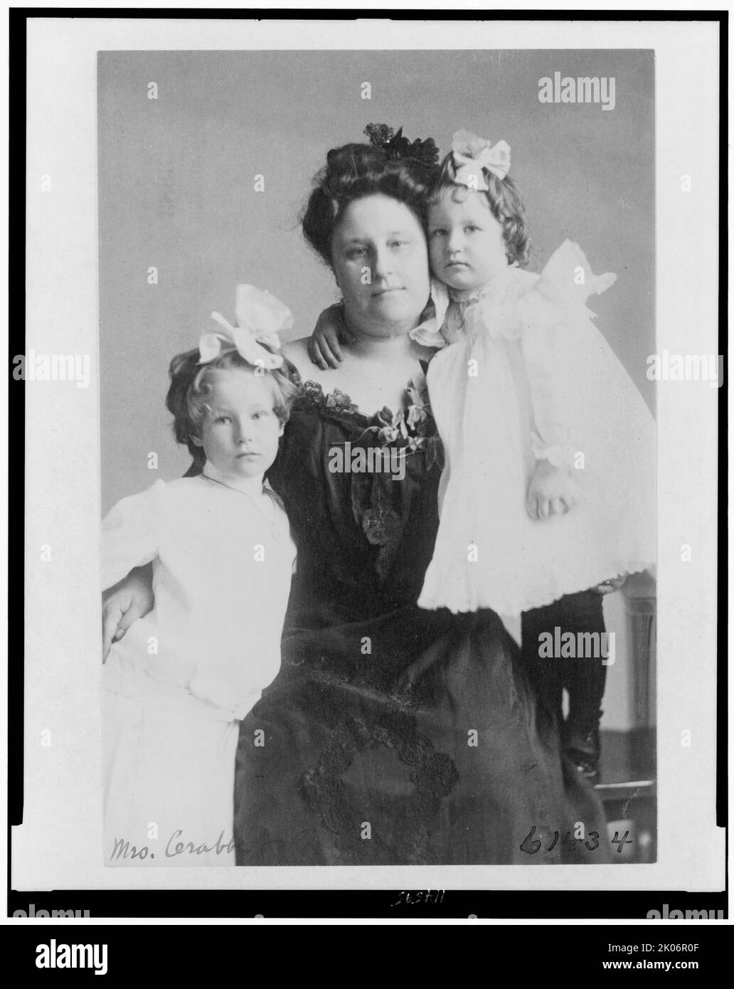 Mrs. Crabbe with two girls, between c1890 and 1910. Stock Photo