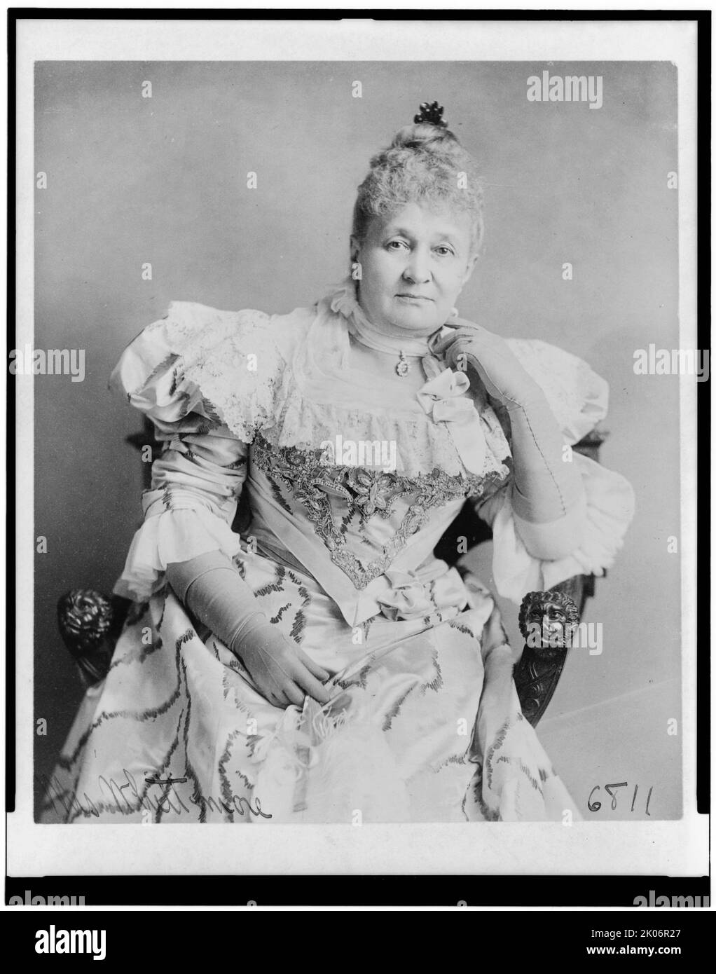 Mrs. Whittemore, between c1890 and 1910. Mrs. Whittemore, three-quarter length portrait, seated, facing front. Stock Photo