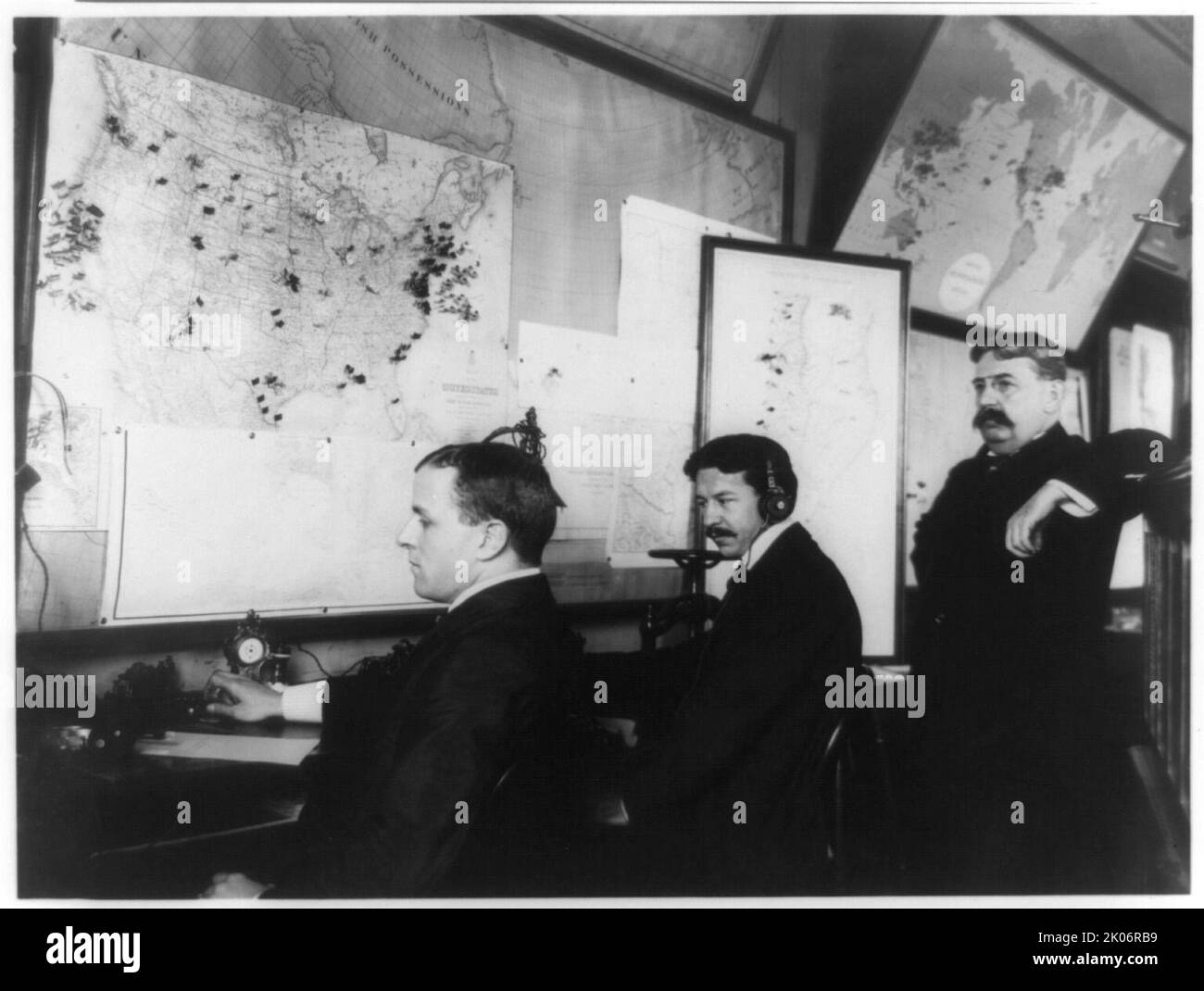 E.C. Heasley, Jules A. Rodier and Maj. Montgomery in the telegraph room in the White House, set up to receive news of the Spanish-American War, 1898. Stock Photo