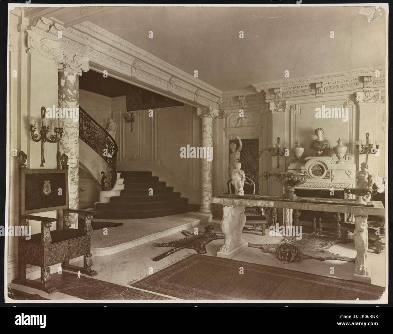 Mary Scott Townsend house, Washington, D.C., between 1910 and 1911. Photograph shows stair hall with grand staircase, decorative fireplace, furniture, and sculpture at the Townsend house, later home of Mathilde and B. Sumner Wells, now the Cosmos Club, 2121 Massachusetts Ave., N.W., Washington, D.C. Stock Photo