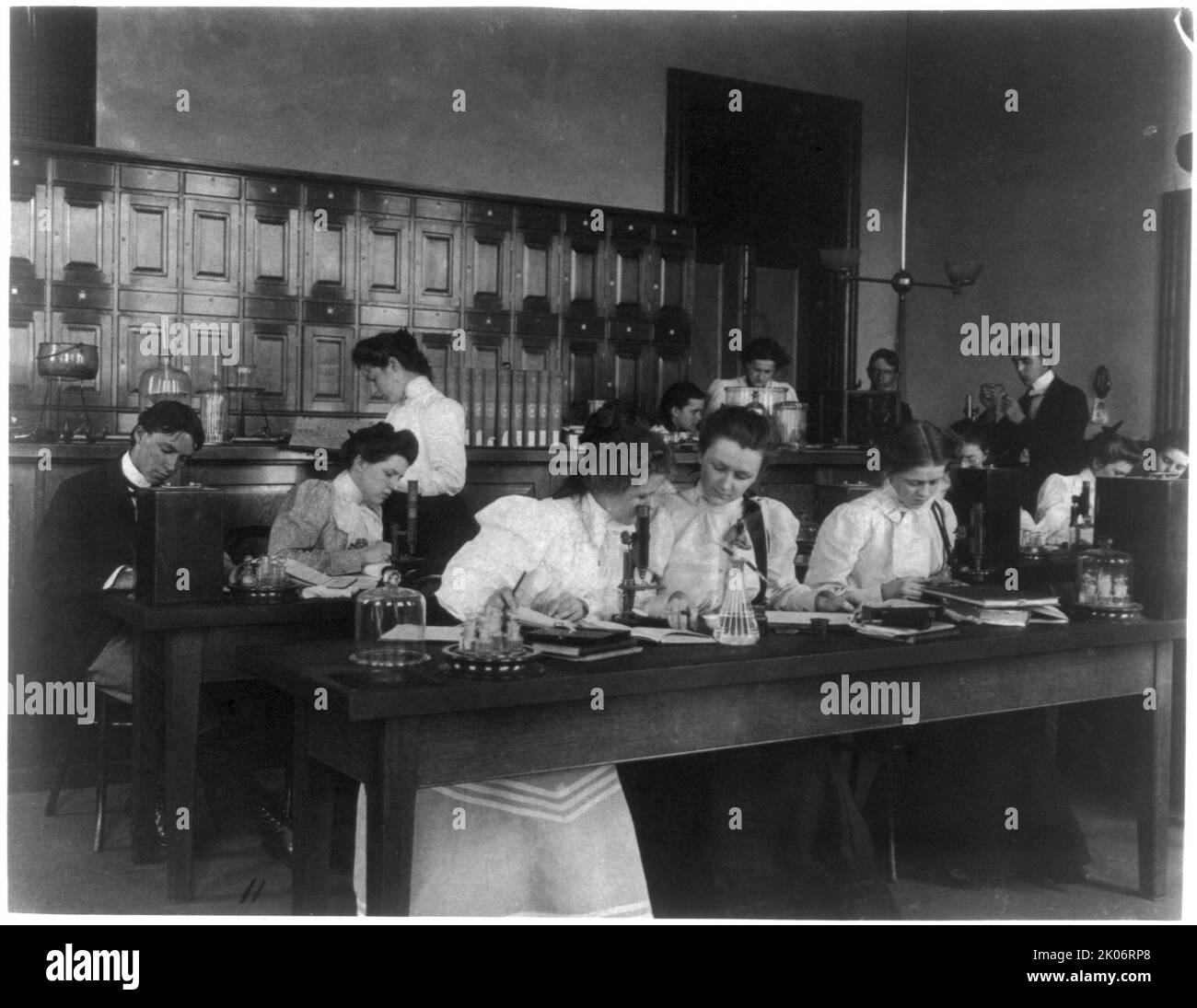 Students in a science class using microscopes, Western High School, Washington, D.C., (1899?). Stock Photo