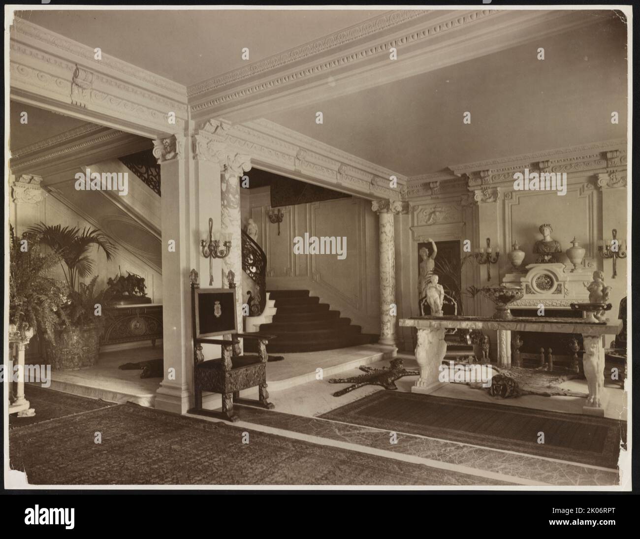 Mary Scott Townsend house, Washington, D.C., c1910. Photograph shows stair hall with grand staircase, decorative fireplace, furniture, and sculpture at the Townsend house, later home of Mathilde and B. Sumner Wells, now the Cosmos Club, 2121 Massachusetts Ave., N.W., Washington, D.C. Stock Photo