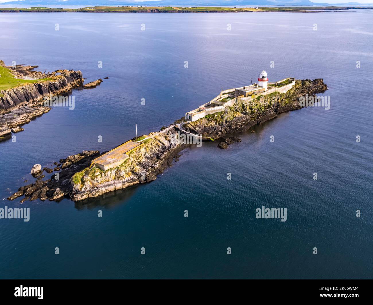 Aerial of the Rotten Island Lighthouse with Killybegs in background - County Donegal - Ireland. Stock Photo