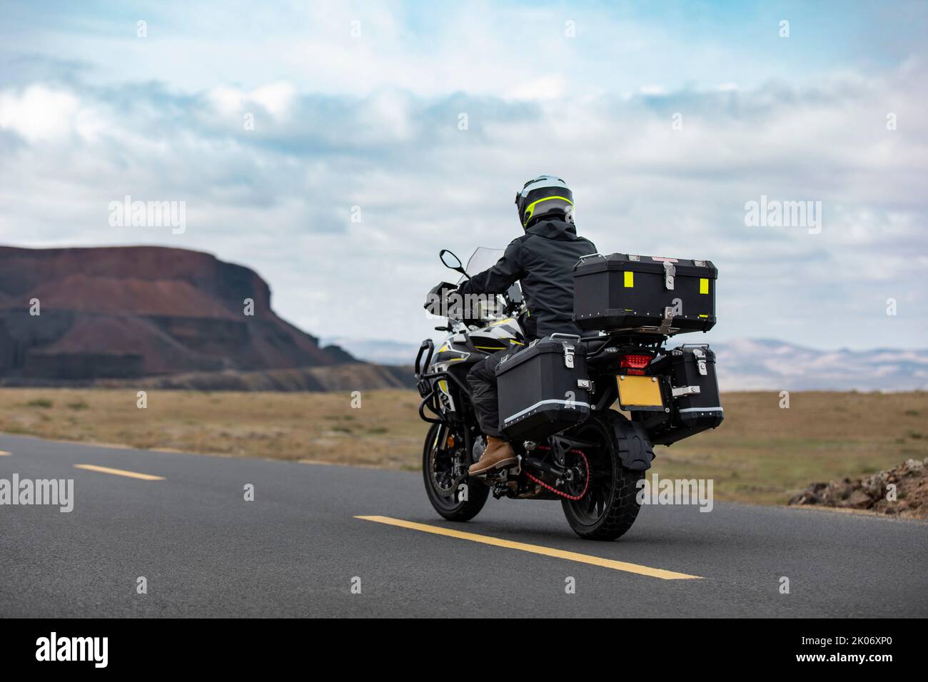 Chinese mid adult man riding motorcycle Stock Photo - Alamy