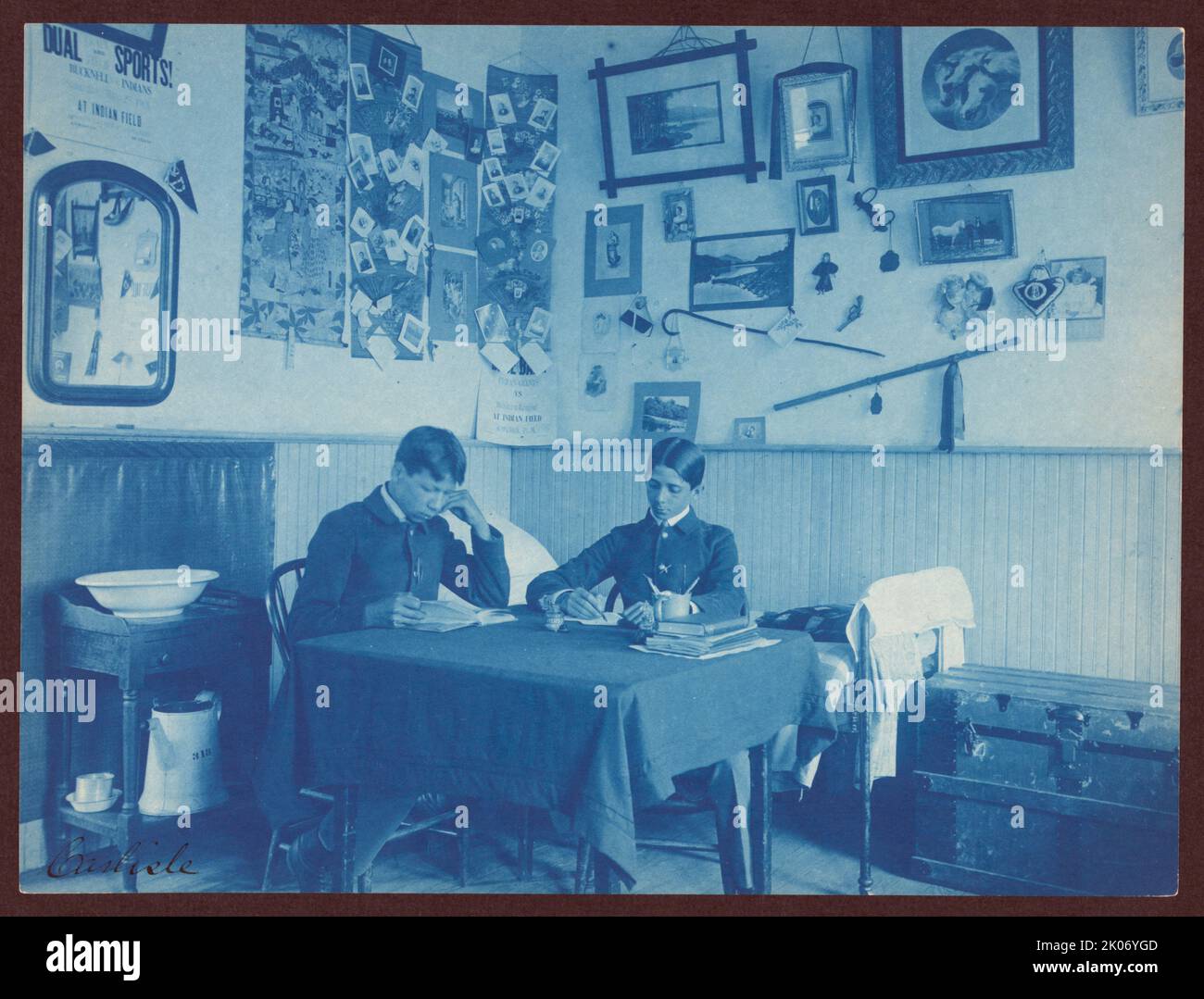 Carlisle Indian School, Carlisle, Pa. Two boys studying in dormitory