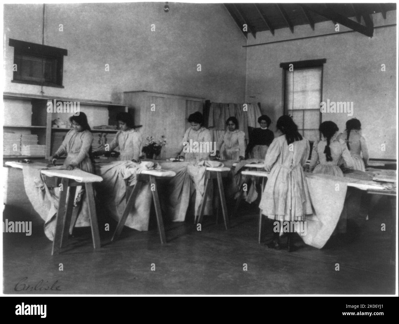 Carlisle Indian School, Carlisle, Pa. Ironing class, 1901. Stock Photo