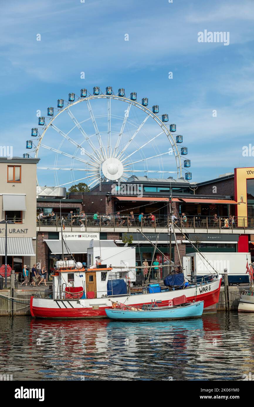 Big Wheel, boats and restaurants at Am Strom, Hanse-Sail, Warnemünde, Rostock, Mecklenburg-West Pomerania, Germany Stock Photo