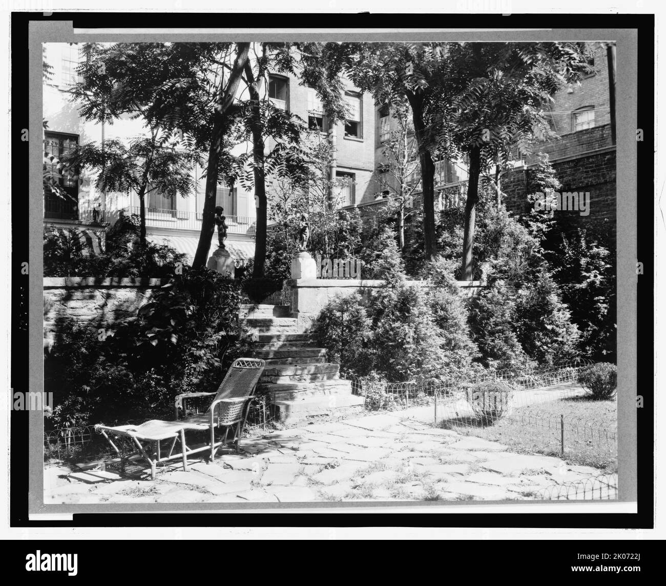 Patio and gardens in New York City, 1921. Photograph shows garden and patio behind residential buildings in Jones Wood, New York City. Stock Photo