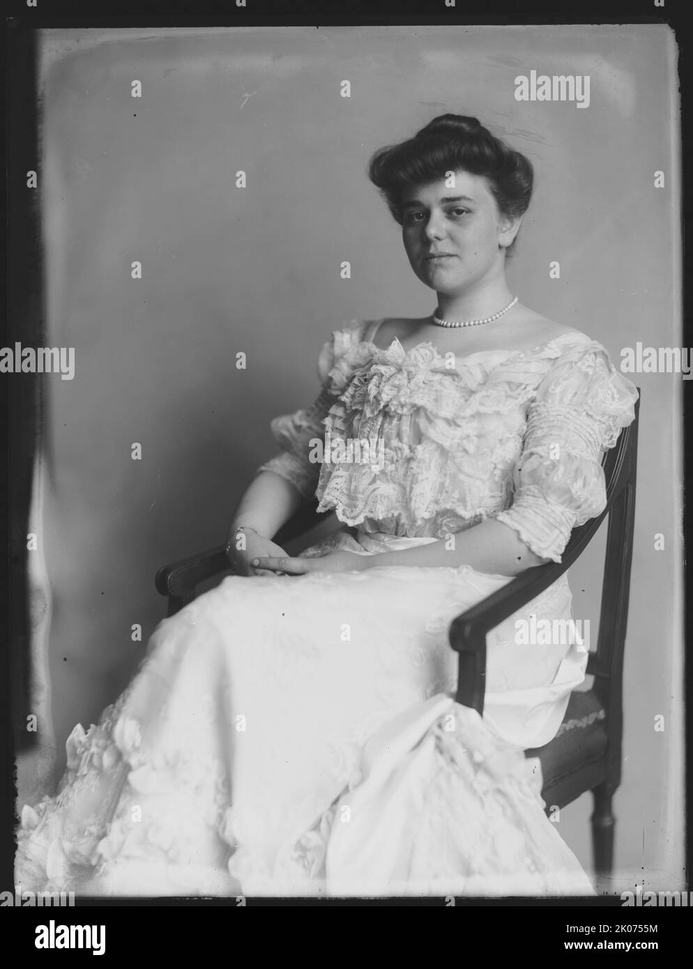 Miss Alice Hay, between 1890 and 1920. Photograph shows three-quarter length portrait of Alice Hay (Mrs. James Wolcott Wadsworth), seated in chair, facing front. She was the daughter of ambassador and statesman John Milton Hay. Stock Photo